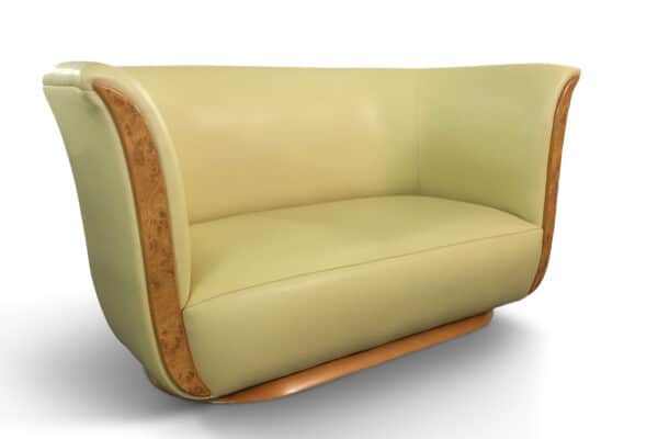 The Tulip 2 Seater in Pullman Ivory by Neumann Leathers. Panelling and base in Elm Burr.