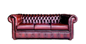 a red leather couch with pillows
